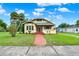 Beautiful home with a brick walkway, well-manicured lawn, and mature landscaping at 1013 W 20Th St, Sanford, FL 32771
