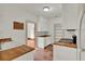 Functional kitchen with butcher block countertops, white cabinetry, and terra cotta tile floors at 1013 W 20Th St, Sanford, FL 32771