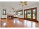 Inviting living room with a brick fireplace, hardwood floors, and a ceiling fan for comfort at 1013 W 20Th St, Sanford, FL 32771