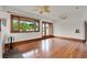 Bright living room with hardwood floors, large windows, ceiling fans, and classic archway at 1013 W 20Th St, Sanford, FL 32771