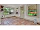 Cozy sunroom with terracotta tile flooring and multiple windows at 1013 W 20Th St, Sanford, FL 32771