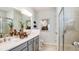 Modern bathroom with double vanity, shower, and decorative accents at 1023 Ladyfish Trl, St Cloud, FL 34771