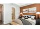 Cozy bedroom features a comfortable bed, stylish lamps, and serene colors at 1023 Ladyfish Trl, St Cloud, FL 34771