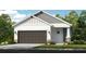 Charming single-Gathering home featuring a neutral palette, two-car garage and manicured lawn at 1023 Ladyfish Trl, St Cloud, FL 34771