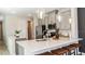 Bright kitchen with a white countertop island, stainless steel appliances and overhead lighting at 1023 Ladyfish Trl, St Cloud, FL 34771