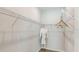 Bright walk-in closet offers ample storage with white wire shelving, perfect for organization at 1023 Ladyfish Trl, St Cloud, FL 34771