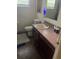 Small bathroom featuring a single vanity, a toilet, and a framed mirror at 1807 N Powers Dr, Orlando, FL 32818