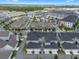 Extensive aerial view of the community featuring lush landscaping and upscale townhomes at 1859 Island Village Way, Kissimmee, FL 34747