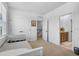 Bright bedroom offers a comfortable daybed and convenient access to an ensuite bathroom and hallway at 1859 Island Village Way, Kissimmee, FL 34747