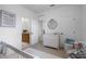 A well-lit Bedroom showcases a charming dresser and access to a convenient ensuite bathroom at 1859 Island Village Way, Kissimmee, FL 34747