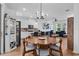 Open concept layout with wood floors combining kitchen, dining, and living spaces at 1859 Island Village Way, Kissimmee, FL 34747