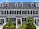 Beautiful townhome with dormer windows and lush, green landscaping at 1859 Island Village Way, Kissimmee, FL 34747