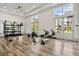 Bright fitness center with modern equipment, large windows, and sleek flooring at 1859 Island Village Way, Kissimmee, FL 34747