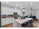Bright kitchen with quartz countertops, modern appliances, and seamless view into the living area at 1859 Island Village Way, Kissimmee, FL 34747