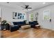 Cozy living room featuring a comfortable blue sectional, wood coffee table, and modern decor at 1859 Island Village Way, Kissimmee, FL 34747