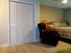 Bedroom features closet and room for seating area at 1935 Conway Rd # M1, Orlando, FL 32812