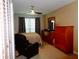 Comfortable bedroom with ceiling fan, window with blinds and light-blocking curtains at 1935 Conway Rd # M1, Orlando, FL 32812