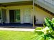 Condo exterior featuring a sliding glass door and front door beneath the stairway at 1935 Conway Rd # M1, Orlando, FL 32812