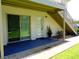 Exterior featuring a sliding glass door and front door beneath an exterior stairway at 1935 Conway Rd # M1, Orlando, FL 32812