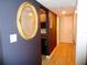 Hallway leading to kitchen and bathroom with wood-look vinyl flooring at 1935 Conway Rd # M1, Orlando, FL 32812