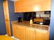 Spacious kitchen with granite countertops, and light wood cabinets at 1935 Conway Rd # M1, Orlando, FL 32812
