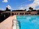 Beautiful community pool with metal railing and lounge chairs. Perfect for relaxation and enjoying the sun at 1935 Conway Rd # M1, Orlando, FL 32812