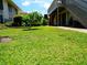 Exterior yard view with a tree and grassy lawn area at 1935 Conway Rd # M1, Orlando, FL 32812