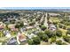 An aerial photograph showcases a suburban neighborhood with tree-lined streets and manicured lawns at 238 Hunt St, Clermont, FL 34711
