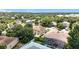 Aerial view of a house nestled in a lush, green neighborhood with a swimming pool at 238 Hunt St, Clermont, FL 34711