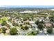 Aerial view of homes near a lake, surrounded by mature trees and including a school building at 238 Hunt St, Clermont, FL 34711