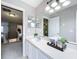 Well-lit bathroom features a single sink vanity with large mirror, perfect for morning routines at 238 Hunt St, Clermont, FL 34711