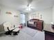 Charming Bedroom featuring a wooden crib, glider chair, and soft neutral tones at 238 Hunt St, Clermont, FL 34711