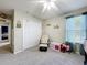 Another view of the Bedroom, showing a closet, chair, and soft curtains to allow light in at 238 Hunt St, Clermont, FL 34711