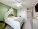 Comfortable bedroom featuring a queen-size bed, a dresser, and a spacious closet at 238 Hunt St, Clermont, FL 34711