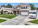 Charming two-story home with a two-car garage, landscaped front yard, and extended driveway at 238 Hunt St, Clermont, FL 34711