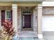 Close up view of the front door, columns and brick facade at 238 Hunt St, Clermont, FL 34711