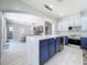 Contemporary kitchen with a large center island, pendant lighting, and an open view to the dining area at 238 Hunt St, Clermont, FL 34711