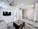 Spacious living area with a large fan, recessed lights and modern flooring at 238 Hunt St, Clermont, FL 34711