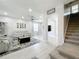 Open-concept living room featuring modern decor, plush seating, and ample natural light at 238 Hunt St, Clermont, FL 34711