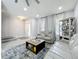 Bright living room with stylish sofas, large windows, and modern flooring at 238 Hunt St, Clermont, FL 34711