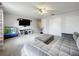 Another angle of the living room shows TV, storage, and gray sectional in the background at 238 Hunt St, Clermont, FL 34711