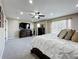 Spacious primary bedroom with recessed lighting, a ceiling fan, a TV, and a large bed at 238 Hunt St, Clermont, FL 34711