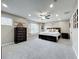 Spacious primary bedroom featuring a queen-size bed, a dresser, and a ceiling fan at 238 Hunt St, Clermont, FL 34711