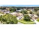 An aerial view of a lovely neighborhood featuring well-maintained lawns and diverse home styles, and mature trees providing ample shade at 238 Hunt St, Clermont, FL 34711
