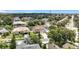 A beautiful suburban neighborhood showcasing diverse home styles, lush greenery, mature trees, and manicured lawns on a sunny day at 238 Hunt St, Clermont, FL 34711
