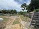 Expansive backyard with plenty of room for outdoor activities, mature trees and partial fencing at 269 12Th Ave, Ocoee, FL 34761