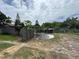 Expansive backyard with mature trees and ample space for outdoor activities and gardening at 269 12Th Ave, Ocoee, FL 34761