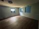 Bedroom with hardwood floors, blue window frames and natural light at 269 12Th Ave, Ocoee, FL 34761