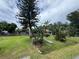 Charming home with mature trees and lush landscaping, creating a serene and inviting atmosphere at 269 12Th Ave, Ocoee, FL 34761