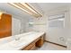 Bathroom featuring a double sink vanity, large mirror, and tiled floors at 3310 Tall Timber Dr, Orlando, FL 32812